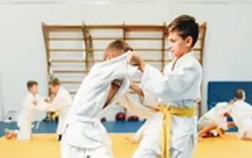 a group of people in karate uniforms