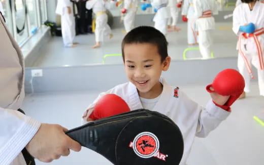 a boy in a karate uniform