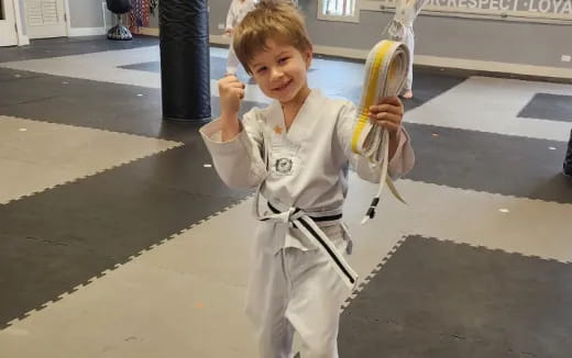 a child holding a bow and arrow
