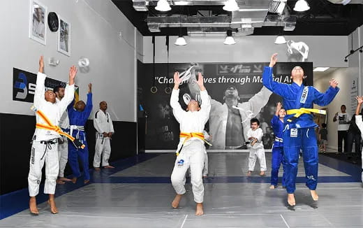 a group of people in karate uniforms