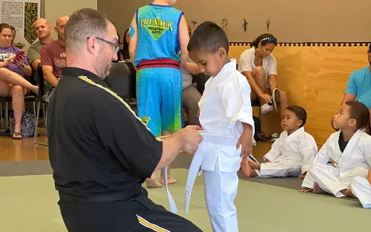 a person shaking hands with a boy