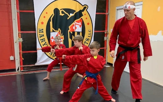 a group of people in red suits