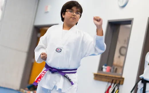 a boy wearing a karate uniform