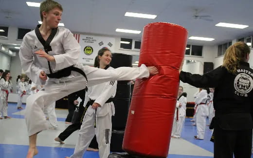 a group of people in karate uniforms