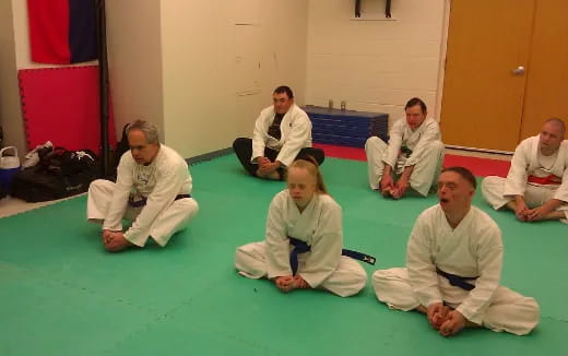 a group of people sitting on the floor