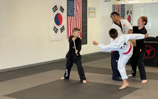 a group of people in karate uniforms
