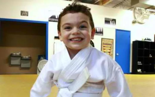 a boy smiling for the camera