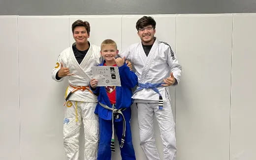 a group of people in karate uniforms