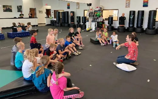 a group of children sitting on the floor