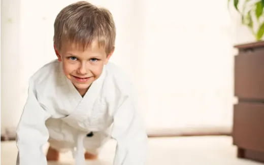 a boy smiling at the camera