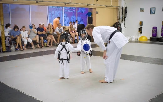 two people in white karate uniforms