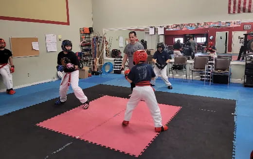 a group of kids in a karate class