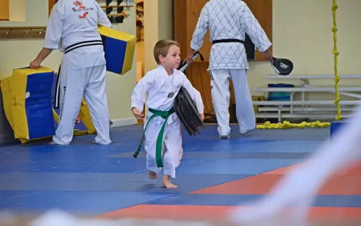 a boy in a karate uniform