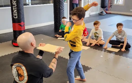 a group of kids playing with a toy