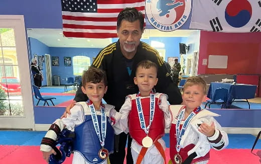 a person with a medal with boys