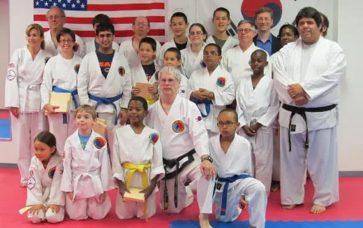 a group of people in karate uniforms