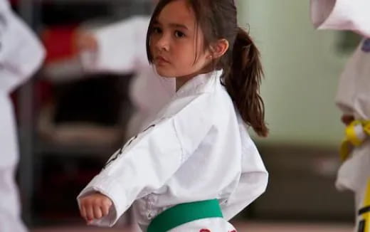 a young girl in a white shirt