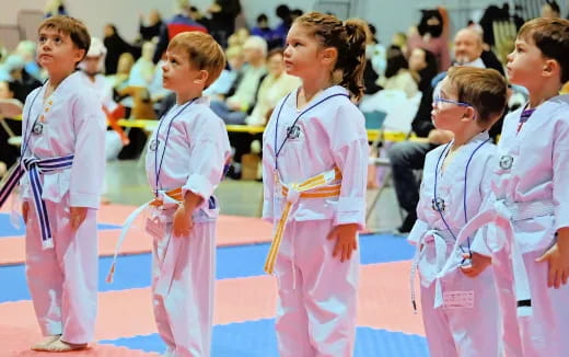 a group of children in matching outfits