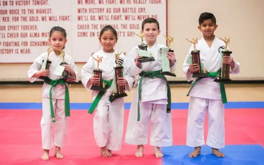 a group of women wearing karate uniforms
