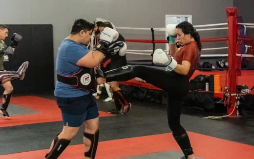 a group of people in a boxing ring