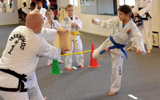 a group of people in karate uniforms