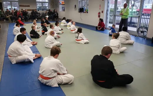 a group of people sitting on the floor