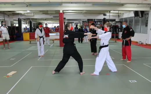 a group of people in karate uniforms