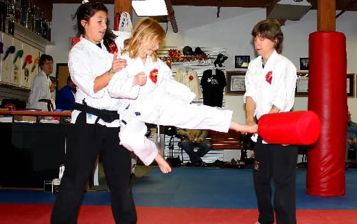 a group of people in karate uniforms