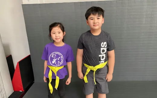 two boys standing next to each other