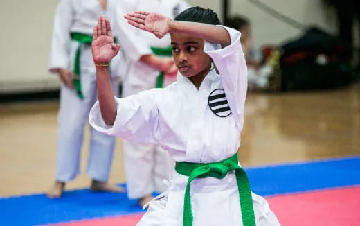 a group of people in karate uniforms
