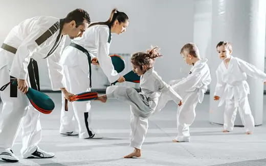 a group of people in karate uniforms