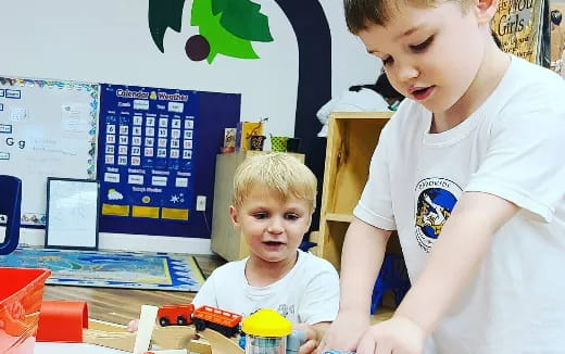 a person and a child playing with toys