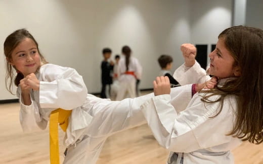 a woman in a karate uniform