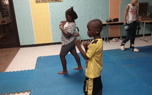 a couple of children playing in a room