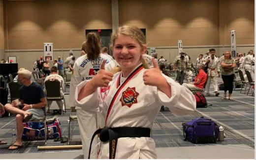 a person in a karate uniform
