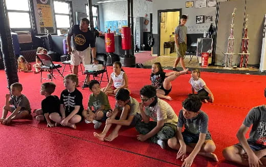 a group of children sitting on the floor