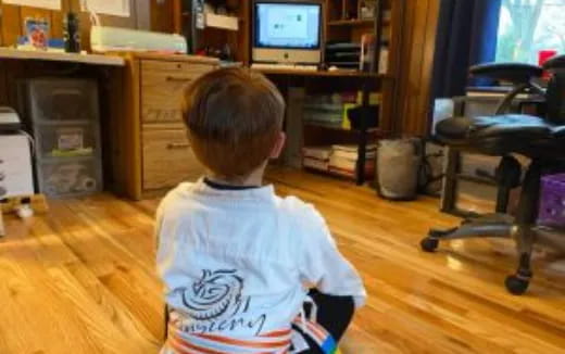 a boy sitting in a chair