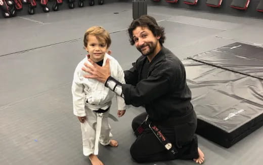 a person and a child posing for the camera