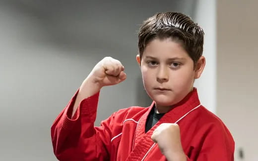 a boy in a red shirt