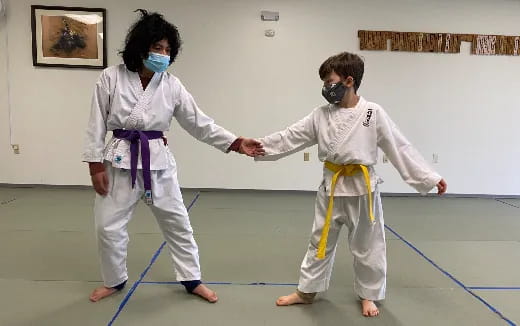 a couple people wearing white outfits