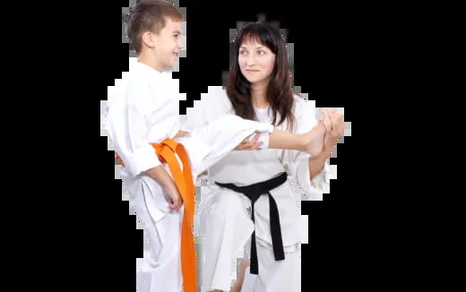 a man and woman in karate uniforms