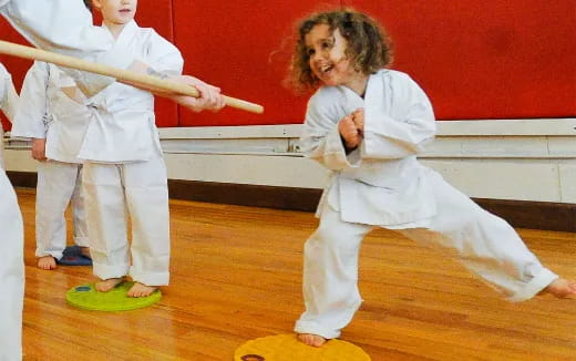 a group of people in karate uniforms