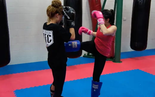 a group of women in a boxing ring
