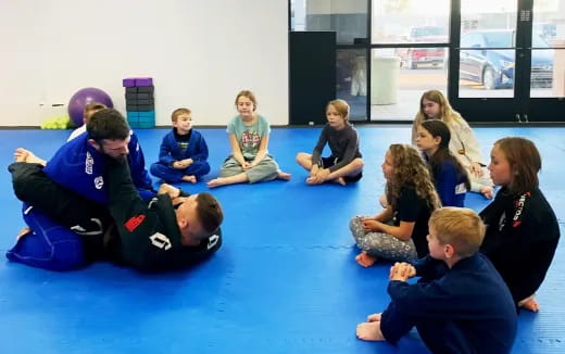 a group of people sitting on the floor