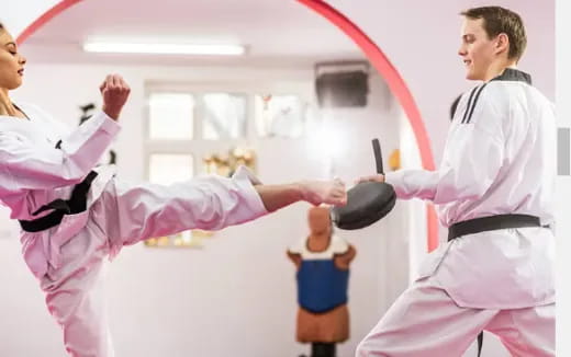 a man and a woman in karate uniforms