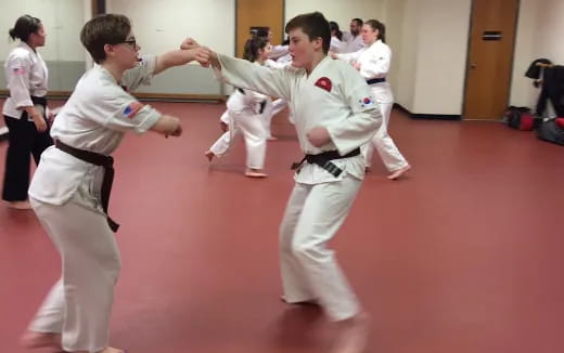 a group of people in karate uniforms