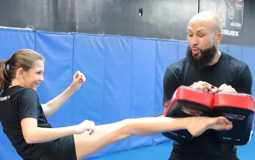 a man and a woman in a gym