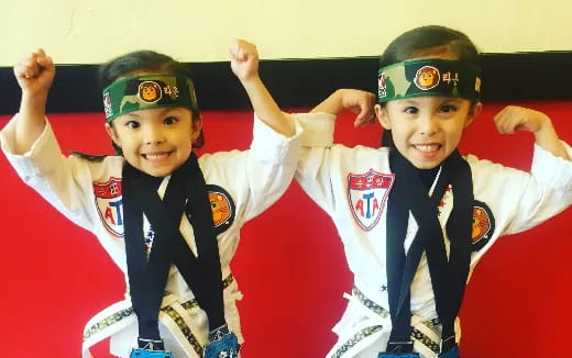 a group of kids wearing matching outfits