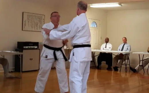 a man in white karate uniform