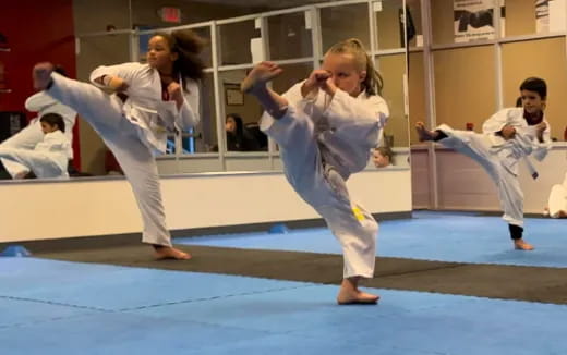 a group of people in karate uniforms